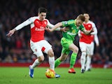 Hector Bellerin of Arsenal and Duncan Watmore of Sunderland compete for the ball during the Barclays Premier League match between Arsenal and Sunderland at Emirates Stadiumon December 5, 2015