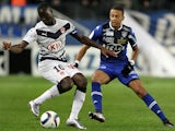 Bordeaux's French forward Henri Saivet (L) vies with Bastia's French midfielder Axel Ngando during the L1 football match Bastia (SCB) against Bodeaux (GDB) on December 2, 2015, at the Armand Cesari stadium in Bastia, on the French Mediterranean island of 