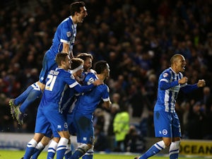 Tomer Hemed of Brighton celebrates with team mates after scoring the teams third and winning goal of the game during the Sky Bet Championship match between Brighton and Hove Albion and Charlton Athletic at The Amex Stadium on December 05, 2015