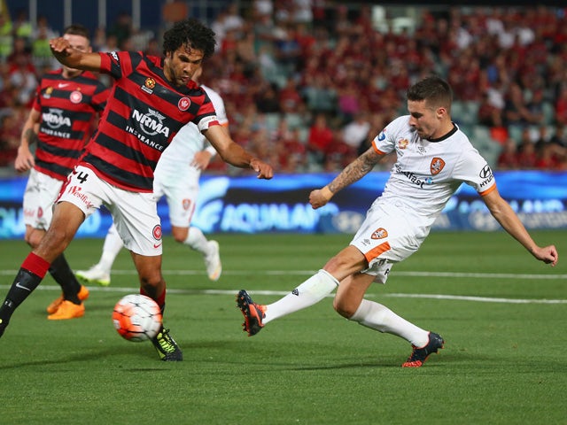 Nikolai Topor-Stanley of the Wanderers fails to block the shot of Jamie Maclaren of the Roar as he scores a goal during the round nine A-League match between the Western Sydney Wanderers and the Brisbane Roar at Pirtek Stadium on December 5, 2015