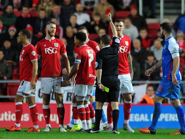 Nathan Baker of Bristol City (2nd L) is sent off during the Sky Bet Championship match between Bristol City and Blackburn Rovers at Ashton Gate on December 5, 2015