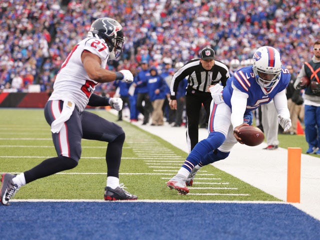 Tyrod Taylor #5 of the Buffalo Bills runs for a touchdown as Quintin Demps #27 of the Houston Texans defends during the first half at Ralph Wilson Stadium on December 6, 2015