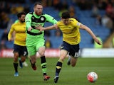 Callum O'Dowda of Oxford holds off pressure from Sam Wedgbury of Forest Green during The Emirates FA Cup Second Round match between Oxford United and Forest Green at Kassam Stadium on December 6, 2015 in Oxford, England.