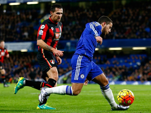 Eden Hazard of Chelsea and Charlie Daniels of Bournemouth compete for the ball during the Barclays Premier League match between Chelsea and A.F.C. Bournemouth at Stamford Bridge on December 5, 2015 in London, England.