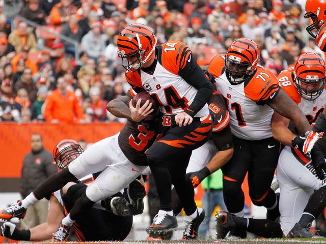 Andy Dalton #14 of the Cincinnati Bengals runs for a first quarter touchdown while playing the Cleveland Browns at FirstEnergy Stadium on December 6, 2015