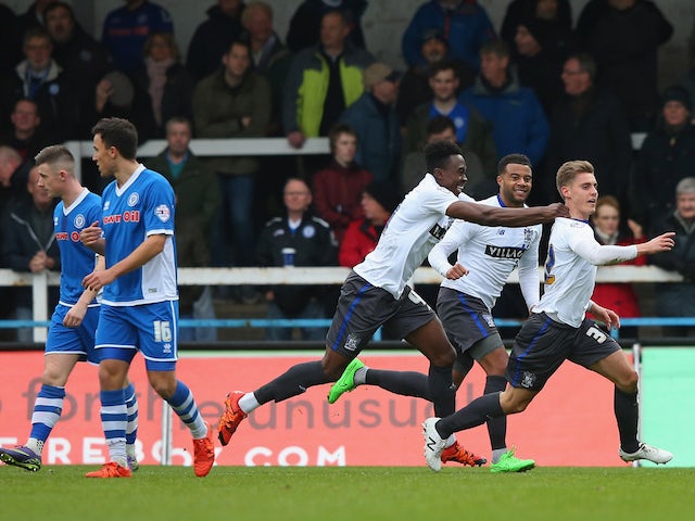  Danny Rose of Bury celebrates with team mates after scoring the opening goal during The Emirates FA Cup Second Round match between Rochdale and Bury at Spotland on December 6, 2015 in Rochdale, England.
