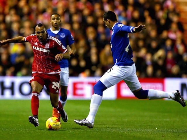 Emilio Nsue (L) of Middlesbrough challenges Ramiro Funes Mori of Everton during their Capital One Cup Quarter Final at Riverside Stadium on December 1, 2015 in Middlesbrough, England.
