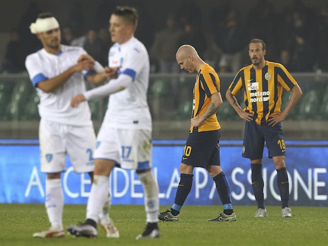Emil Hallfredsson (2nd R) and Evangelos Moras (R) of Hellas Verona FC show their dejection at the end of the Serie A match between Hellas Verona FC and Empoli FC at Stadio Marc'Antonio Bentegodi on December 6, 2015 in Verona, Italy. 