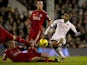 Fulham's Mousa Dembele (R) shoots at goal past a challenge from Liverpool's Danish player Daniel Agger (L) during the English Premier League football match at Craven Cottage in London on December 5, 2011. Fulham won the game 1-0.