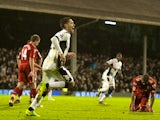 Fulham's US midfielder Clint Dempsey (2nd L) runs to celebrate after scoring against Liverpool during the English Premier League football match at Craven Cottage in London on December 5, 2011. Fulham won the game 1-0.