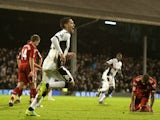 Fulham's US midfielder Clint Dempsey (2nd L) runs to celebrate after scoring against Liverpool during the English Premier League football match at Craven Cottage in London on December 5, 2011. Fulham won the game 1-0.