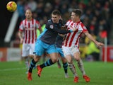 Gary Hooper of Sheffield Wednesday and Marco van Ginkel of Stoke City during the Capital One Cup match between Stoke City and Sheffield Wednesday at the Britannia Stadium on December 1, 2015 in Stoke-on-Trent, England.