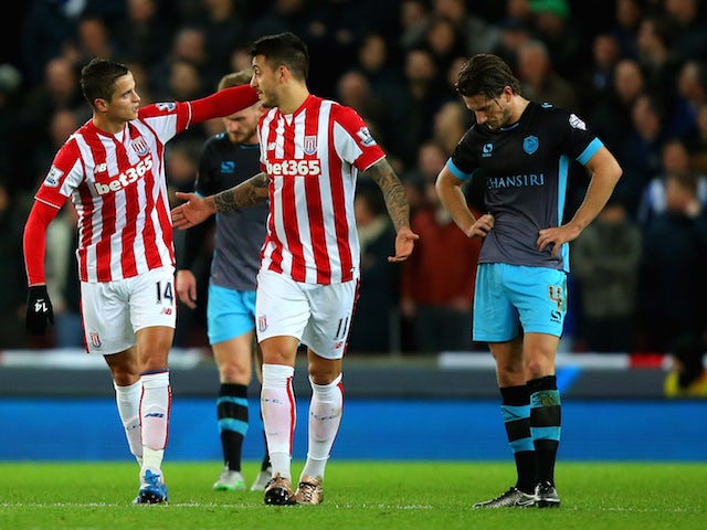 Ibrahim Afellay of Stoke City (L) celebrates his goal with Joselu of Stoke City during the Capital One Cup match between Stoke City and Sheffield Wednesday at the Britannia Stadium on December 1, 2015 in Stoke-on-Trent, England.