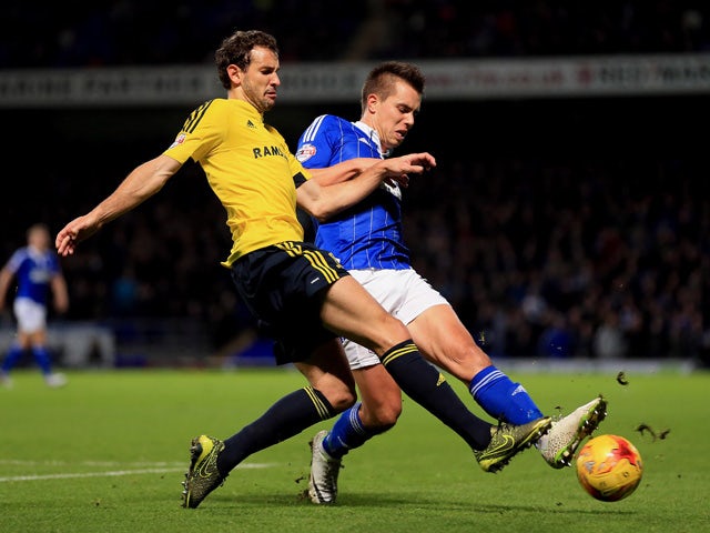 Jonas Knudsen of Ipswich Town and Christian Stuani of Middlesbrough compete for the ball during the Sky Bet Championship match between Ipswich Town and Middlesbrough at Portman Road stadium on December 4, 2015