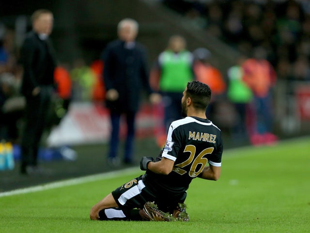 Leicester City's Algerian midfielder Riyad Mahrez celebrates after he scored his second goal during the English Premier League football match between Swansea City and Leicester City at The Liberty Stadium in Swansea, south Wales on December 5, 2015