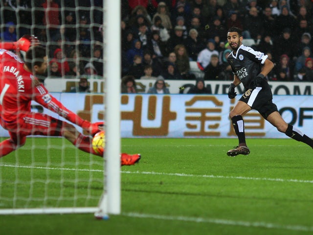 Riyad Mahrez of Leicester City scores his team's third and hat trick goal during the Barclays Premier League match between Swansea City and Leicester City at Liberty Stadium on December 5, 2015