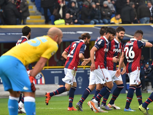 Bologna's defender from Italy Luca Rossettini (C) celebrates with teammates after scoring during the Italian Serie A football match Bologna vs Napoli at the Dall'Ara stadium in Bologna on December 6, 2015. 