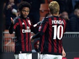 Luiz Adriano (L) of AC Milan celebrates with his team-mate Keisuke Honda (R) after scoring the opening goal during the TIM Cup match between AC Milan and FC Crotone at Stadio Giuseppe Meazza on December 1, 2015 in Milan, Italy.