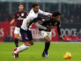 Luiz Adriano (R) of AC Milan is challenged by Gian Marco Ferrari (L) of FC Crotone during the TIM Cup match between AC Milan and FC Crotone at Stadio Giuseppe Meazza on December 1, 2015 in Milan, Italy.