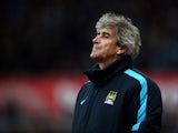 Manuel Pellegrini, manager of Manchester City looks on during the Barclays Premier League match between Stoke City and Manchester City at Britannia Stadium on December 5, 2015