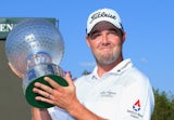 Marc Leishman of Australia celebrates victory with the trophy after the final round on day four of the Nedbank Golf Challenge at Gary Player CC on December 6, 2015 in Sun City, South Africa.