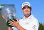 Marc Leishman of Australia celebrates victory with the trophy after the final round on day four of the Nedbank Golf Challenge at Gary Player CC on December 6, 2015 in Sun City, South Africa.
