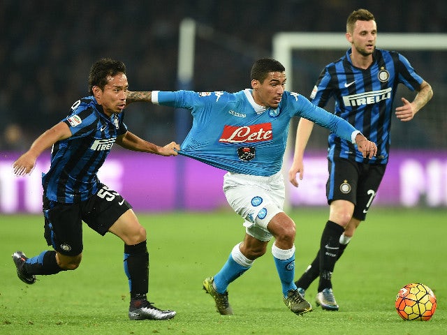 Napoli's player Marques Loureiro Allan vies with FC Internazionale Milano player Yuto Nagatomo during the Serie A match between SSC Napoli and FC Internazionale Milano at Stadio San Paolo on November 30, 2015 in Naples, Italy.