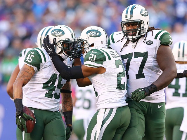 Rontez Miles #45 of the New York Jets celebrates after intercepting the ball in the fourth quarter against the New York Giants at MetLife Stadium on December 6, 2015