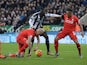Newcastle United's Senegalese striker Papiss Cisse (2R) vies with Liverpool's English defender Nathaniel Clyne (R) and Liverpool's Slovakian defender Martin Skrtel (2L) during the English Premier League football match between Newcastle United and Liverpoo