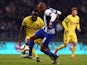 Porto's Algerian midfielder Yacine Brahimi (C) vies with Pacos de Ferreira's midfielder Pele (L) during the Portuguese league football match FC Porto vs FC Pacos de Ferreira at the Dragao stadium in Porto on December 5, 2015.