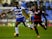 Garath McCleary of Reading holds off Sandro of QPR during the Sky Bet Championship match between Reading and Queens Park Rangers on December 3, 2015