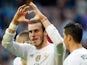 Real Madrid's Welsh forward Gareth Bale gestures as he celebrates a goal during the Spanish league football match Real Madrid CF vs Getafe CF at the Santiago Bernabeu stadium in Madrid on December 5, 2015