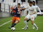 Montpelliers French forward Ryad Boudebouz (L) vies with Marseille's Spanish defender Javier Manquillo during the French L1 football match Olympique de Marseille against Montpellier on December 6, 2015 at Velodrome Stadium in Marseille, southern France.