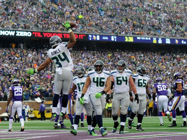 Thomas Rawls #34 of the Seattle Seahawks celebrates a touchdown against the Minnesota Vikings as his teammate look on during the first quarter of the game on December 6, 2015