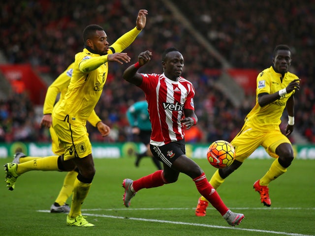 Sadio Mane of Southampton and Leandro Bacuna of Aston Villa compete for the ball during the Barclays Premier League match between Southampton and Aston Villa at St Mary's Stadium on December 5, 2015