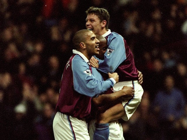 Stan Collymore and Allan Thompson of Aston Villa congratulate team-mate and goal scorer Dion Dublin during the FA Carling Premiership match against Arsenal played at Villa Park in Birmingham, England. The match finished in a dramatic 3-2 win for Aston Vil