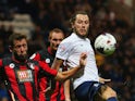Stevie May of Preston North End and Steve Cook of Bournemouth battle for the abll during the Capital One Cup third round match between Preston North End and AFC Bournemouth at Deepdale on September 22, 2015
