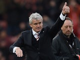 Stoke City's Welsh manager Mark Hughes gestures to the fans following the English Premier League football match between Stoke City and Manchester City at the Britannia Stadium in Stoke-on-Trent, central England on December 5, 2015