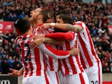 Marko Arnautovic (2nd L) of Stoke City celebrates scoring his team's first goal with his team mates during the Barclays Premier League match between Stoke City and Manchester City at Britannia Stadium on December 5, 2015