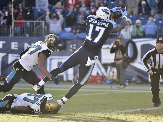 Dorial Green-Beckham #17 of the Tennessee Titans dives to the end zone against the Jacksonville Jaguars during the game at Nissan Stadium on December 6, 2015