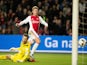 Ajax ' Danish forward Viktor Fischer (L) scores the 4-1 goal past Heerenveen's goalkeeper Erwin Mulder during the Eredivisie football match Ajax vs Heereveen on December 5, 2015 in Amsterdam.