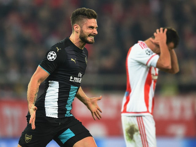 Olivier Giroud of Arsenal celebrates scoring the third goal and his hat-trick for Arsenal during the UEFA Champions League Group F match between Olympiacos FC and Arsenal FC at Karaiskakis Stadium on December 9, 2015 in Piraeus, Greece.