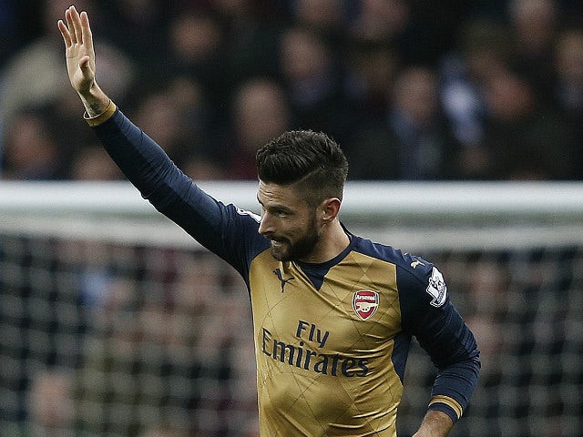 Arsenal's French striker Olivier Giroud celebrates scoring his team's first goal from the penalty spot during the English Premier League football match between Aston Villa and Arsenal at Villa Park in Birmingham, central England on December 13, 2015. 