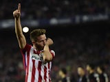 Atletico Madrid's midfielder Saul Niguez celebrates after scoring a goal during the Spanish league football match Club Atletico de Madrid vs Athletic Club Bilbao at the Vicente Calderon stadium in Madrid on December 13, 2015