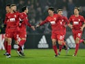 Augsburg's South Korean defender Hong Jeon-Ho (3rd R) celebrates with teammates after scoring a goal during the UEFA Europa League Group L football match between FK Partizan Belgrade and FC Augsburg at the Partizan Stadium in Belgrade on December 10, 2015