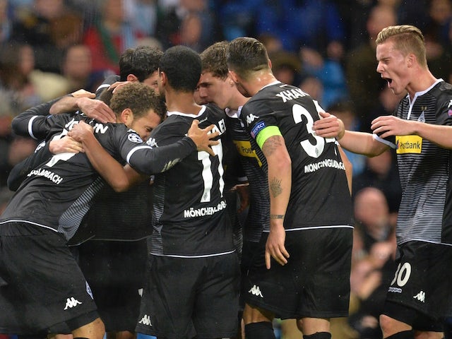 Moenchengladbach players celebrates after their German midfielder Julian Korb scored their first goal to equalise at 1-1 during the UEFA Champions League Group D football match between Manchester City and Borussia Moenchengladbach at the Etihad Stadium in