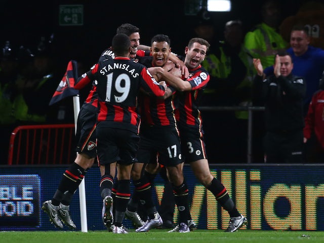 Joshua King (2nd R) of Bournemouth celebrates scoring his team's second goal with his team mates during the Barclays Premier League match between A.F.C. Bournemouth and Manchester United at Vitality Stadium on December 12, 2015 in Bournemouth, United King