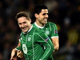 Celtic's Kris Commons (L) celebrates with his teammate Tom Rogic (R) after scoring during the UEFA Europa League football match between Fenerbahce and Celtic at Fenerbahce Sukru Saracoglu stadium in Istanbul on December 10, 2015