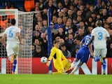 The ball rebounds off Porto's Spanish goalkeeper Iker Casillas (3R) as he saves a shot from Chelsea's Brazilian-born Spanish striker Diego Costa (2R) to hit Porto's Spanish defender Ivan Marcano (L) and ricochet into the goal for an own goal during the UE