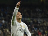 Real Madrid's Portuguese forward Cristiano Ronaldo celebrates after scoring during the UEFA Champions League Group A football match Real Madrid CF vs Malmo FF at the Santiago Bernabeu stadium in Madrid on December 8, 2015.